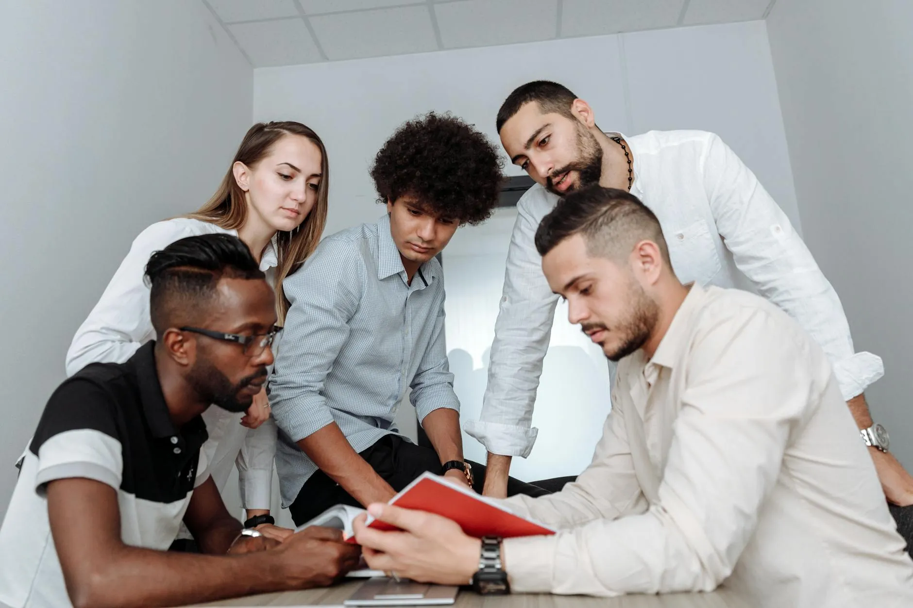 Team of mortgage professionals collaborating in an office