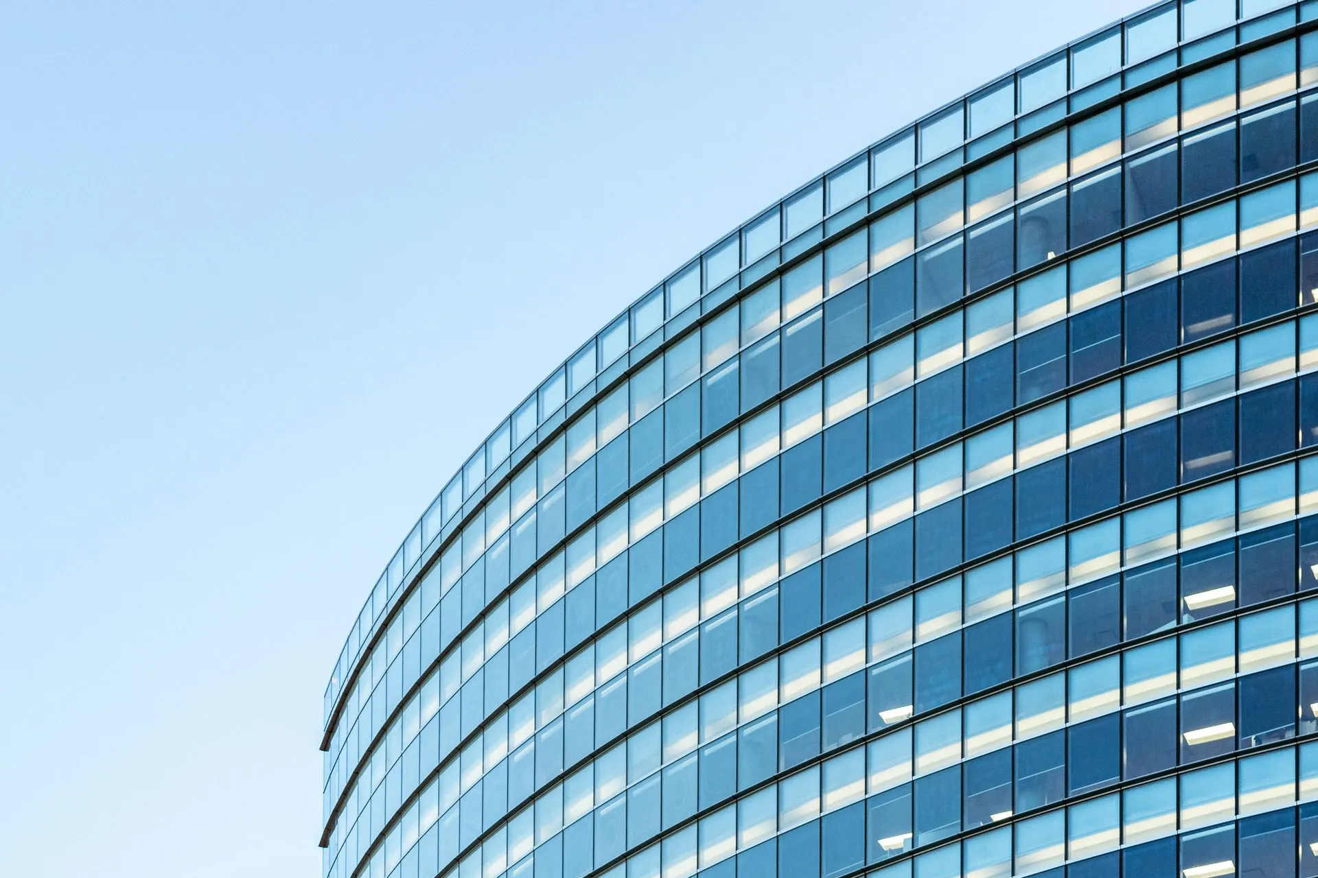 Exterior of a modern curved glass office building