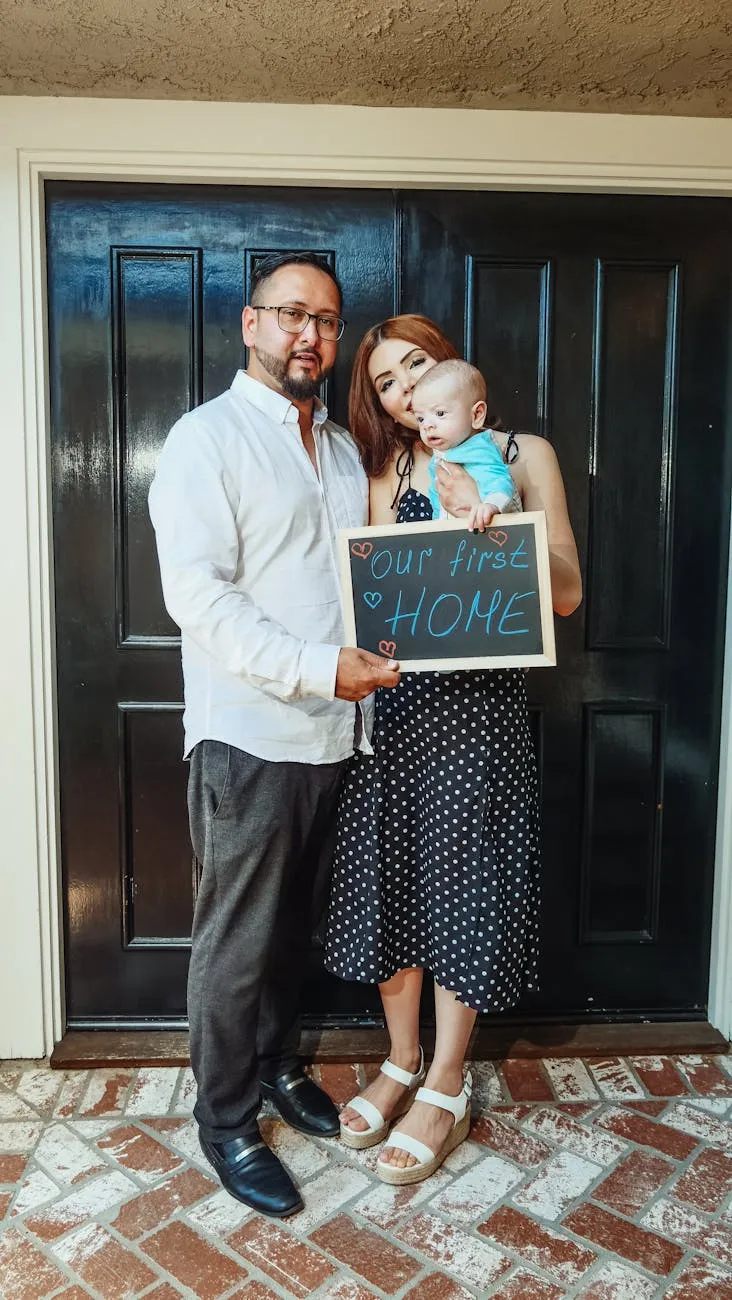 Texas family standing at the front door of their home