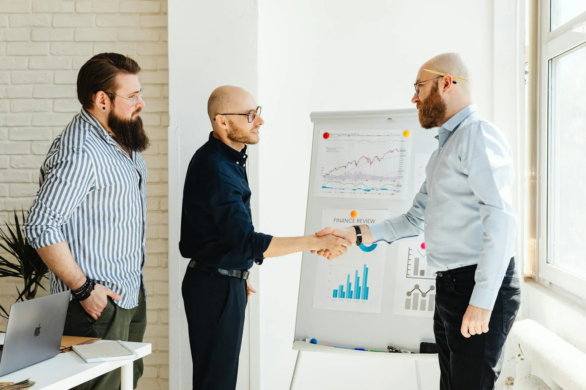 Business partners collaborating around a meeting room table
